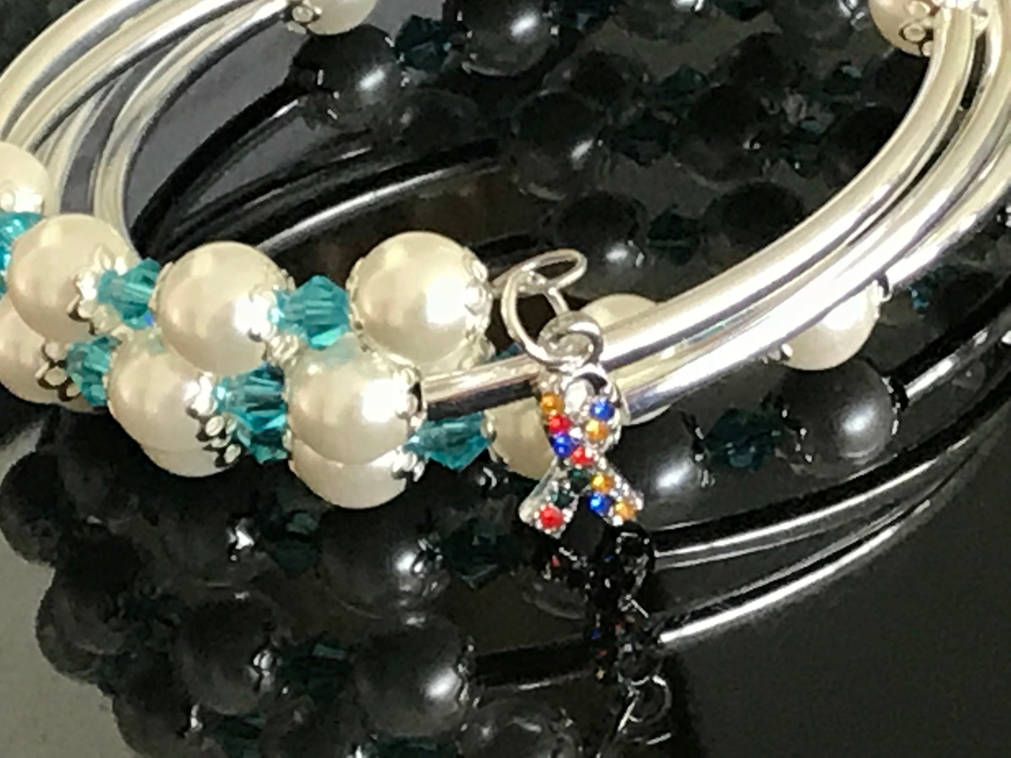 Autism awareness white glass pearls, Swarovski with silver noodle beads on a memory wire bracelet