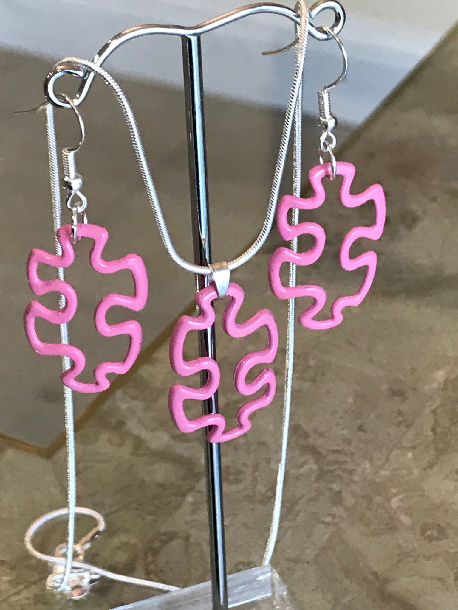 Colored puzzle piece necklace set