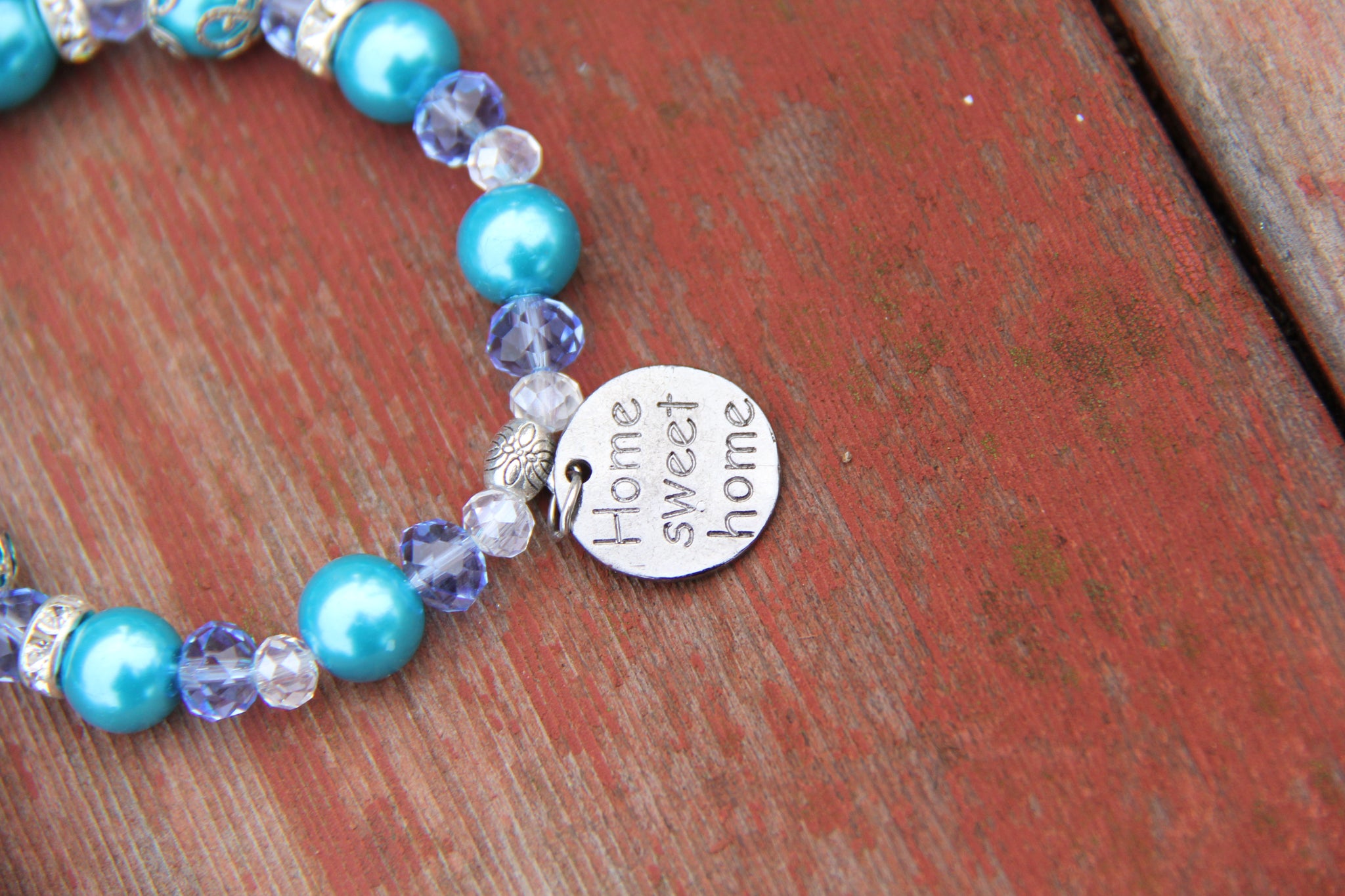 Turquoise and blue beads bottle bracelet with "Home sweet home" charm