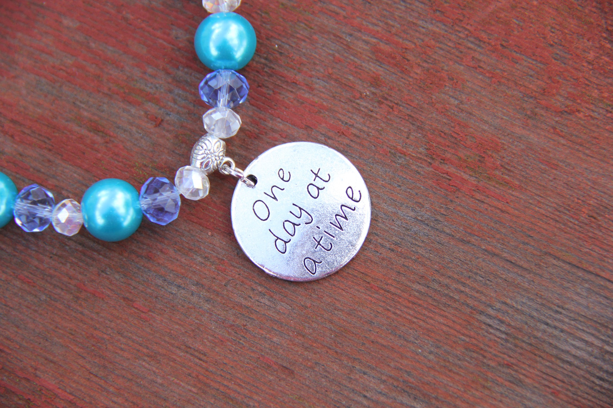 Turquoise glass beads with "one day at a time" charm