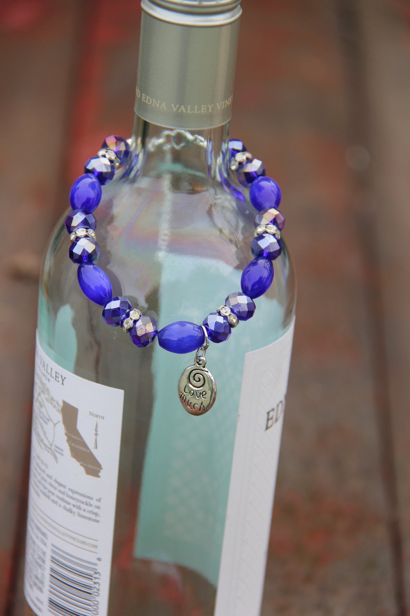 Love much & Laugh Often silver charm navy blue bottle bracelet