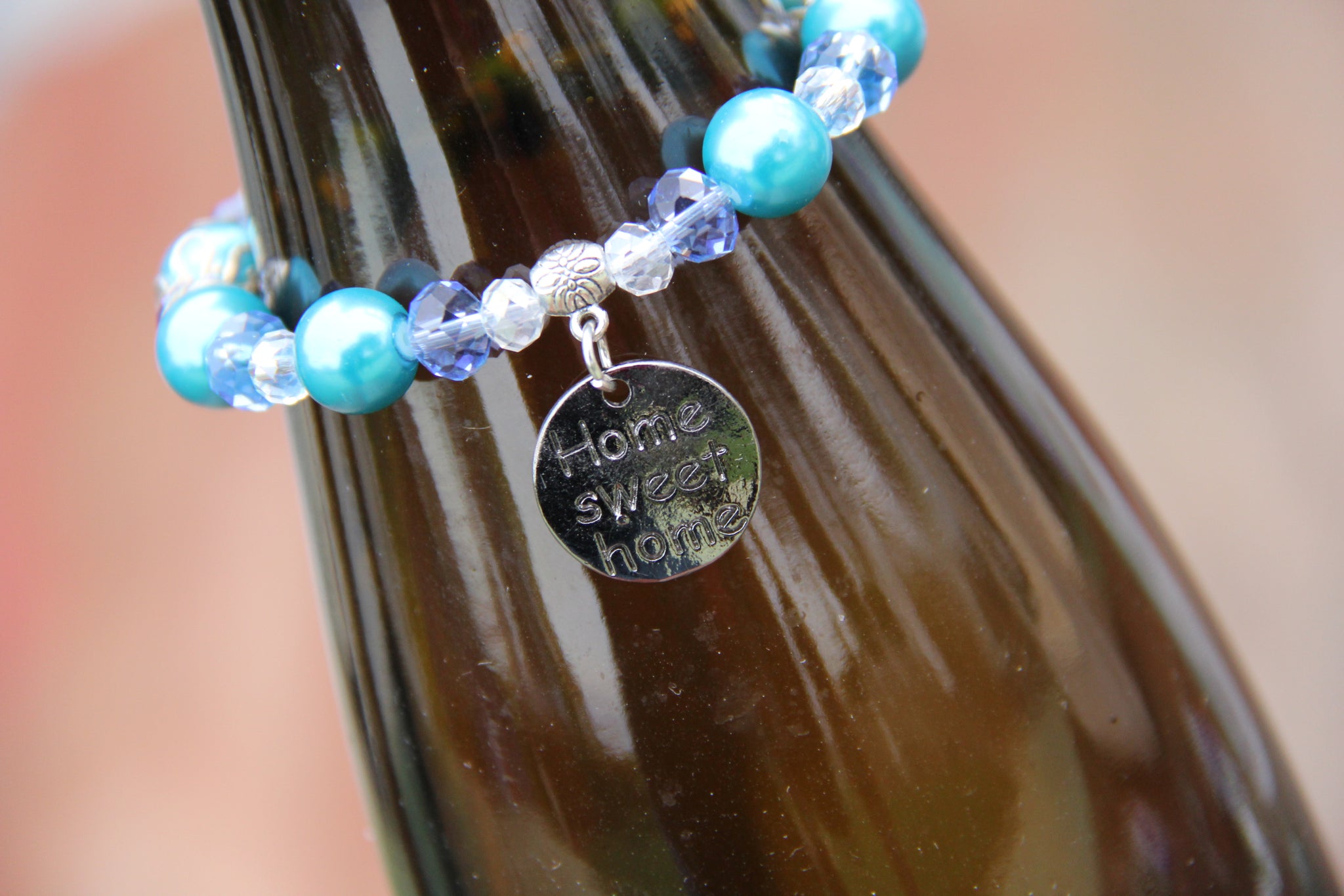 Turquoise and blue beads bottle bracelet with "Home sweet home" charm