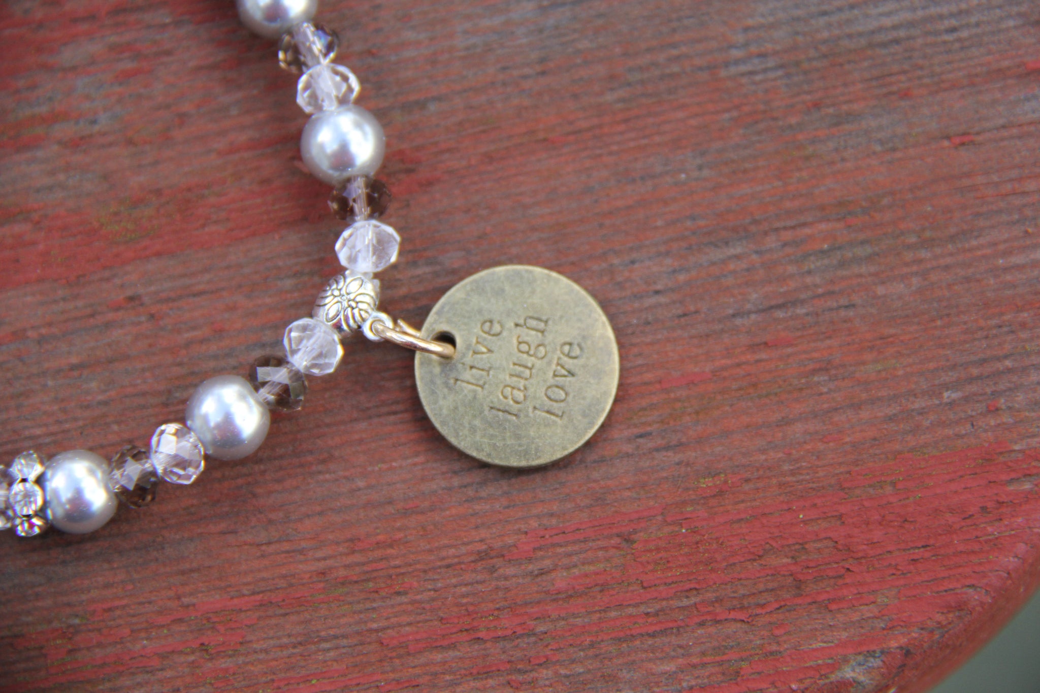 Bottle bracelet made with Grey glass beads with "live laugh love" charm