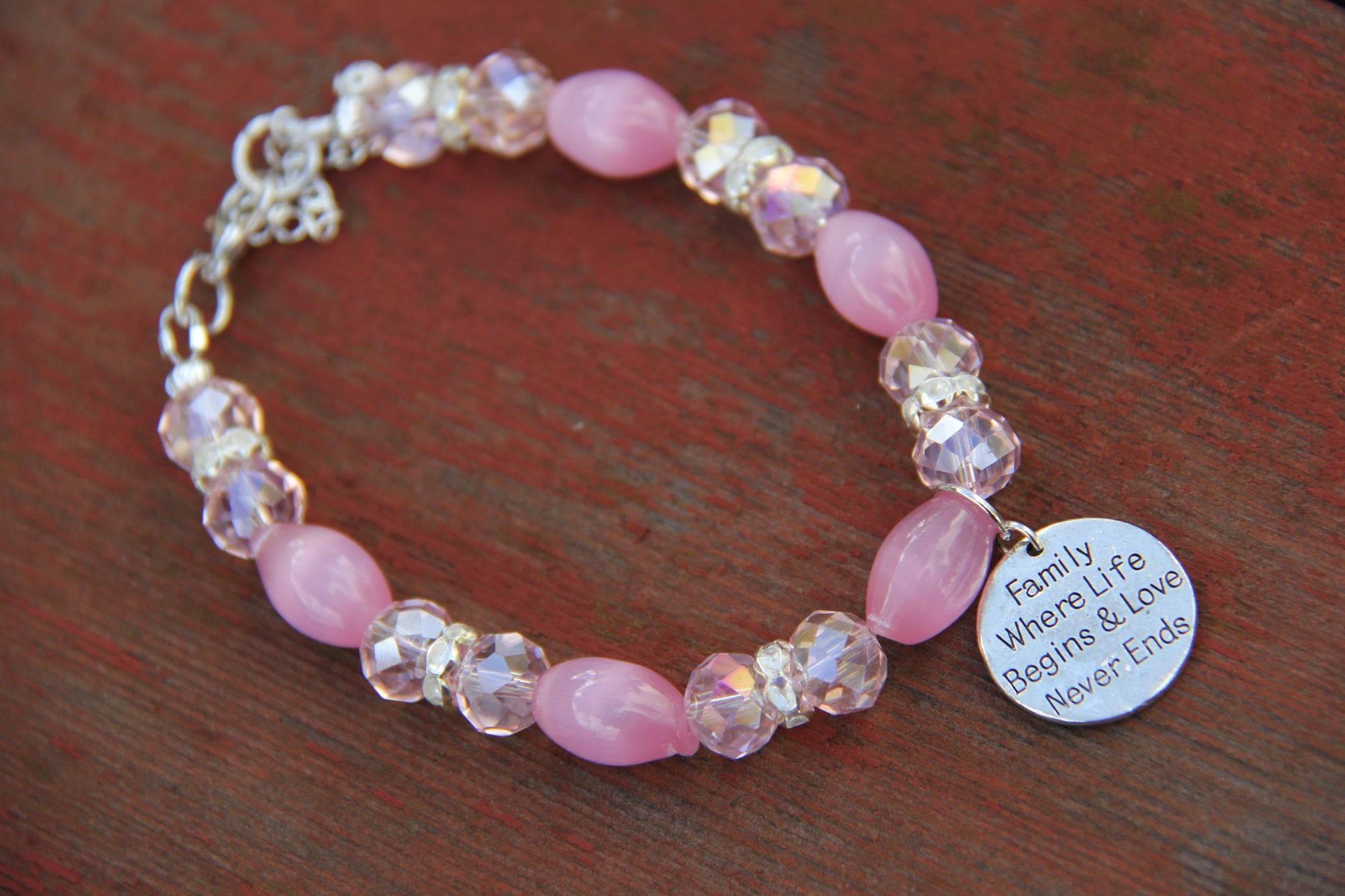  Pink glass beads and a silver charm for bottle bracelet