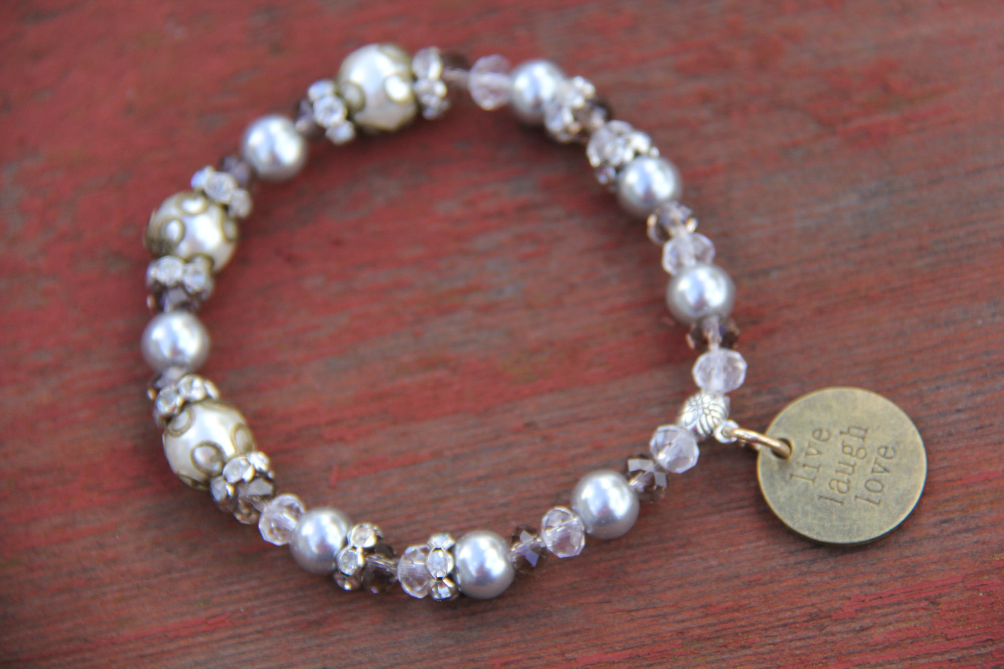 Bottle bracelet made with Grey glass beads with "live laugh love" charm