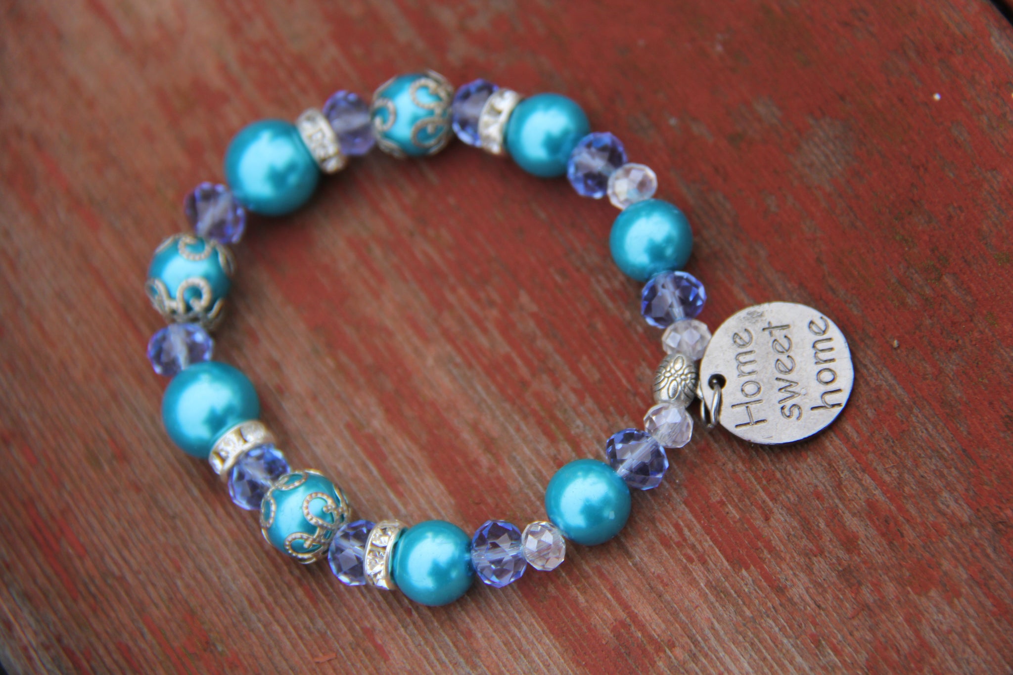 Turquoise and blue beads bottle bracelet with "Home sweet home" charm